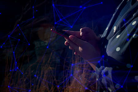 woman hand finger touch on screen smartphone device for connecting to social network internet digital with data safety security cloud storage aiの写真素材