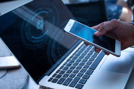 businessman and smartphone mobile and laptop notebook computer in network social online connect to...