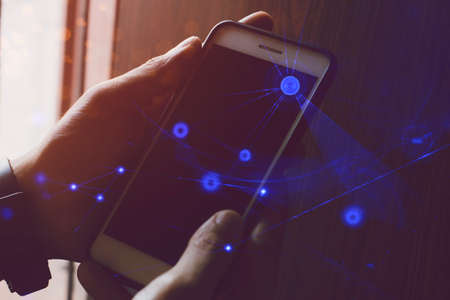businessman hand finger touch on screen smartphone device for connecting to social network bandwidth...