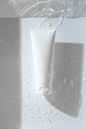 beauty treatment medical skincare and cosmetic lotion cream serum oil mockup bottle packaging product on water splash background, healthcare and medicine conceptの写真素材