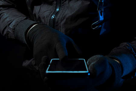 hacker robbery terrorist with tablet smartphone computer attack to server network system online in...