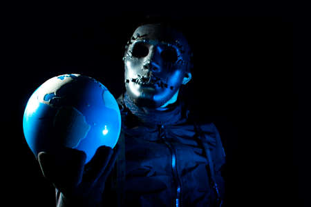 hacker robbery terrorist holding global earth with virus computer attack to server network system online data internet security conceptの写真素材