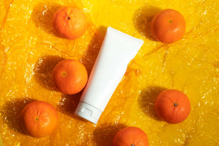 beauty treatment medical skincare and cosmetic lotion cream serum oil mockup bottle packaging product with orange fruit background in healthcare and medicineの写真素材