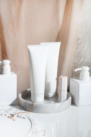 beauty treatment medical skincare cosmetic lotion cream serum mockup bottle packaging product on white decor background in healthcare pharmaceutical medicineの写真素材