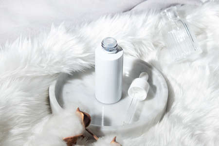 mockup of beauty fashion cosmetic makeup bottle serum dropper product with skincare healthcare concept on backgroundの写真素材