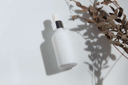 mockup of beauty fashion cosmetic makeup bottle serum dropper product with skincare healthcare concept on backgroundの写真素材