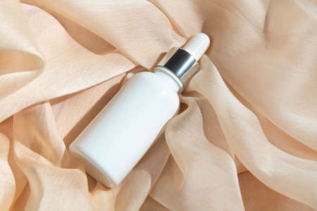 mockup of beauty fashion cosmetic makeup bottle serum dropper product with skincare healthcare concept on backgroundの写真素材