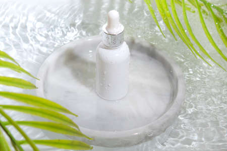 mockup of beauty fashion cosmetic makeup bottle serum dropper product with skincare healthcare concept on backgroundの写真素材