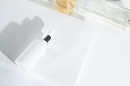 mockup of beauty fashion cosmetic makeup bottle serum dropper product with skincare healthcare product concept on backgroundの写真素材