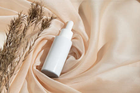 mockup of beauty fashion cosmetic makeup bottle lotion product with skincare healthcare concept on backgroundの写真素材