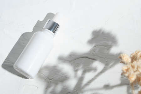 mockup of beauty fashion cosmetic makeup bottle lotion product with skincare healthcare concept on backgroundの写真素材