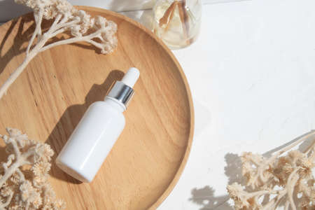 mockup of beauty fashion cosmetic makeup bottle lotion product with skincare healthcare concept on backgroundの写真素材