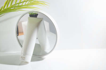 mockup of beauty fashion cosmetic makeup bottle lotion product with skincare healthcare concept on white backgroundの写真素材