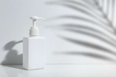 mockup of beauty fashion cosmetic makeup bottle lotion product with skincare healthcare concept on backgroundの写真素材