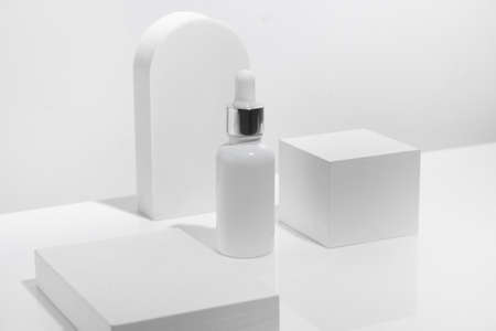 mockup of beauty fashion cosmetic makeup bottle lotion serum dropper product with skincare healthcare concept on backgroundの写真素材