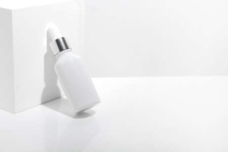 mockup of beauty fashion cosmetic makeup bottle lotion serum dropper product with skincare healthcare concept on backgroundの写真素材