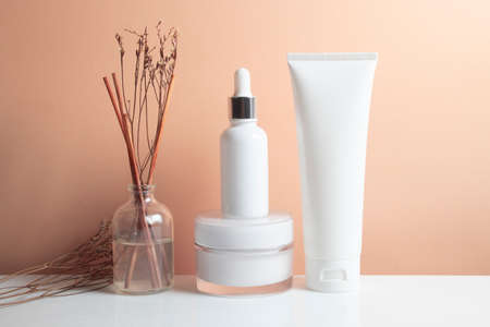 mockup of beauty fashion cosmetic makeup bottle lotion product with skincare healthcare concept on backgroundの写真素材