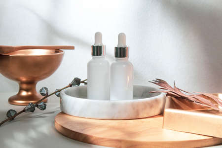 mockup of beauty fashion cosmetic makeup bottle lotion  serum dropper product with skincare healthcare concept on backgroundの写真素材