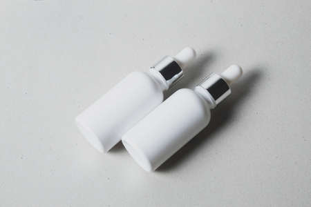 mockup of beauty fashion cosmetic makeup bottle lotion  serum dropper product with skincare...