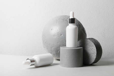 mockup of beauty fashion cosmetic makeup bottle lotion  serum dropper product with skincare healthcare concept on backgroundの写真素材