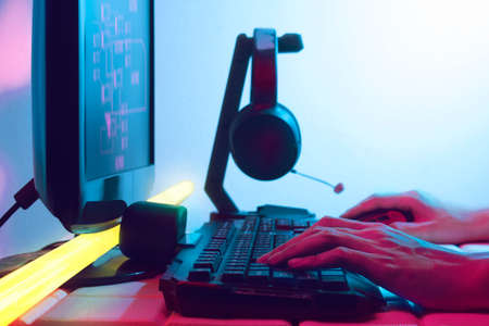 gamer playing game by mouse with computer keyboard, gaming and esports challenge, streaming online, tournament conceptの写真素材