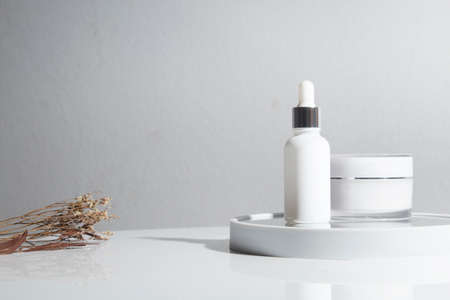 mockup of beauty fashion cosmetic makeup bottle lotion  serum product with skincare healthcare concept on backgroundの写真素材