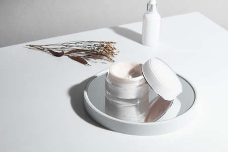 mockup of beauty fashion cosmetic makeup bottle lotion  serum product with skincare healthcare concept on backgroundの写真素材