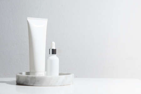 mockup of beauty fashion cosmetic makeup bottle lotion  serum product with skincare healthcare concept on backgroundの写真素材