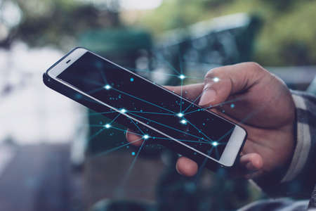 businessman hand finger touch on screen smartphone device for online trading network technology...