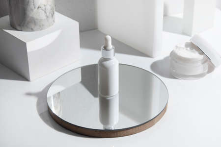 mockup of beauty fashion cosmetic makeup bottle lotion  serum product with skincare healthcare concept on backgroundの写真素材