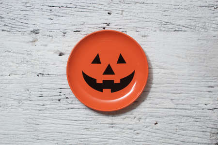 halloween party pumpkin face dish for dinner on white table  and trick or treat autumn october festival and jack-o-lantern conceptの写真素材