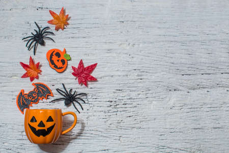 coffee cup of happy halloween party with spooky horror toy on wall background tableの写真素材