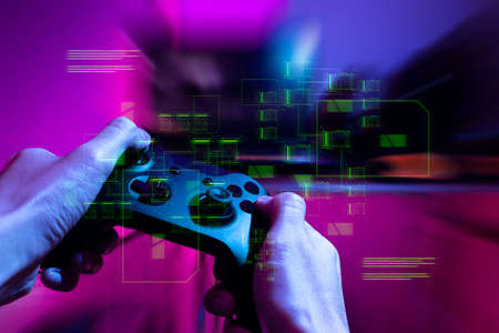 gamer playing game by joystick with computer, gaming and esports challenge, streaming online, tournament conceptの写真素材