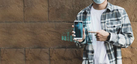teen boy using smartphone device for online network technology internet;  man use mobile in public...