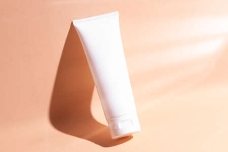 mockup of medical skin care bottle cosmetic tube of beauty makeup facial, treatment cleanser face foam, beauty healthcare branding packaging in water splashの写真素材