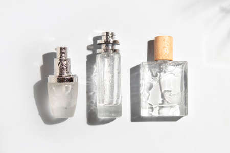 mockup of perfume skin care bottle cosmetic tube of beauty makeup facial, treatment cleanser face foam, beauty healthcare branding packaging in water splashの写真素材