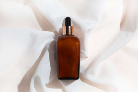 mockup of skin care serum dropper bottle cosmetic tube of beauty makeup facial, treatment cleanser face foam, sunscreen healthcare branding packagingの写真素材