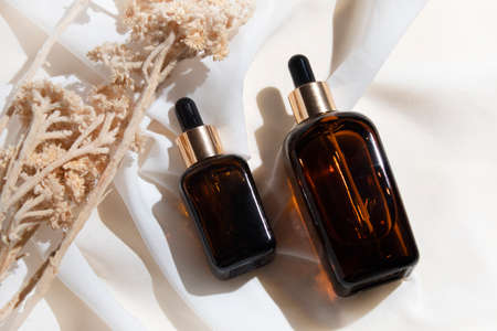 mockup of skin care serum dropper bottle cosmetic tube of beauty makeup facial, treatment cleanser face foam, sunscreen healthcare branding packagingの写真素材