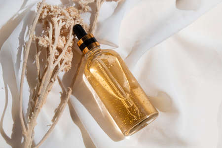 mockup of skin care serum dropper bottle cosmetic tube of beauty makeup facial, treatment cleanser face foam, sunscreen healthcare branding packagingの写真素材