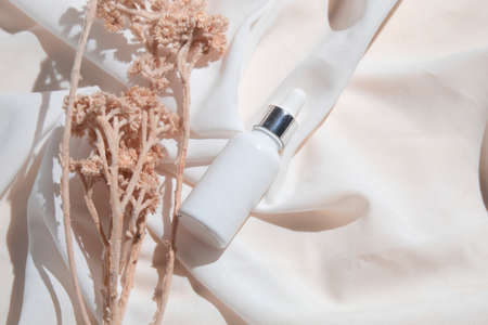 mockup of skin care serum dropper bottle cosmetic tube of beauty makeup facial, treatment cleanser face foam, sunscreen healthcare branding packagingの写真素材