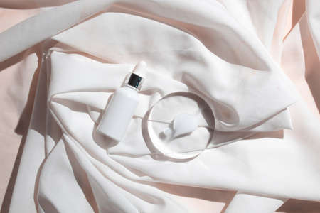 mockup of skin care serum dropper bottle cosmetic tube of beauty makeup facial, treatment cleanser face foam, sunscreen healthcare branding packagingの写真素材