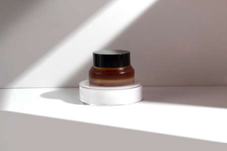 mockup tube bottle for skin care cosmetic, product branding, serum dropper cream lotion treatment with natural flowerの写真素材