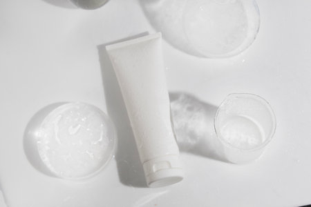 mockup tube bottle for skin care cosmetic with water splash, product branding, serum dropper cream lotion treatmentの写真素材