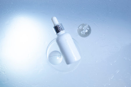 makeup cosmetic medical skin care, a mockup for cream lotion bottle product, packaging on white  waterdrop fresh with glass backgroundの写真素材