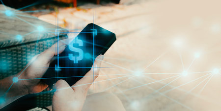 hand of businessman interactive touching a holographic of transaction financial network data system and dollar icon, concept of technology artificial intelligence with human userの写真素材