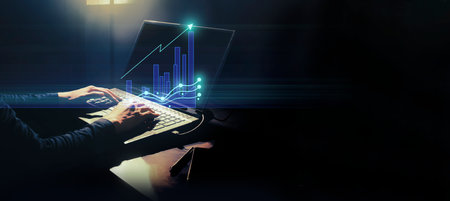 businessman work from home use devic technology to control hologram icon floating, success in financial trading money transaction systemの写真素材