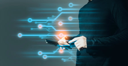hand of businessman interactive touching a holographic of transaction financial network data system, concept of technology artificial intelligence with human userの写真素材