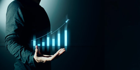 hand of businessman interactive touching a holographic of transaction financial network data system, concept of technology artificial intelligence with human user applicationの写真素材