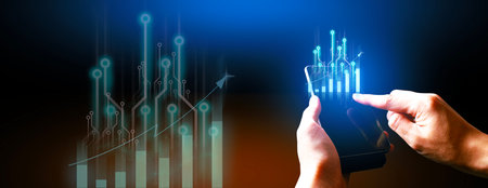 hand of businessman interactive touching a holographic of transaction financial network data system, concept of technology artificial intelligence with human user applicationの写真素材