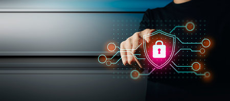 hand of businessman interactive touching a holographic anti-virus security shield system network and...